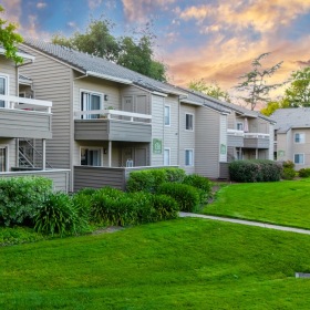 Settle into comfort at The Seasons outdoor grassy area with a sidewalk